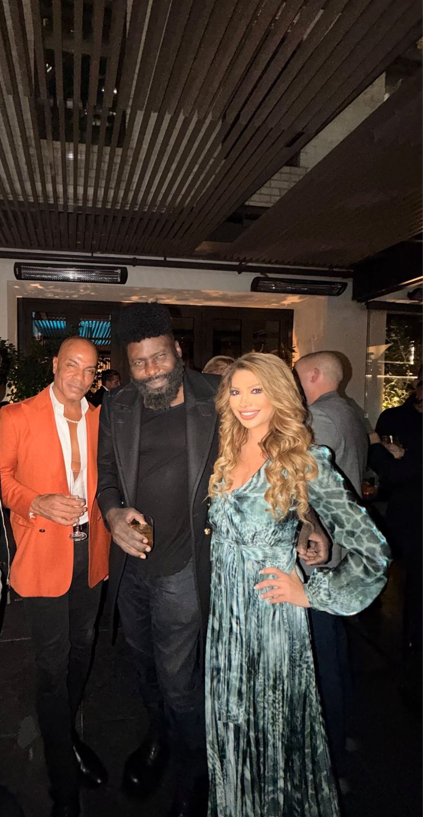 Three guests at an evening event