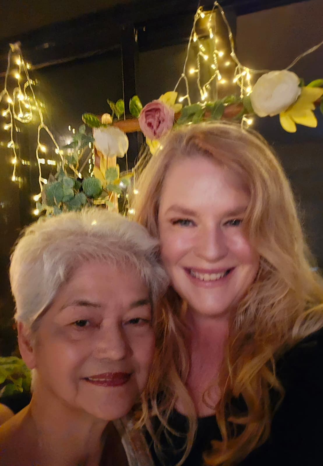 Two friends at a festive celebration