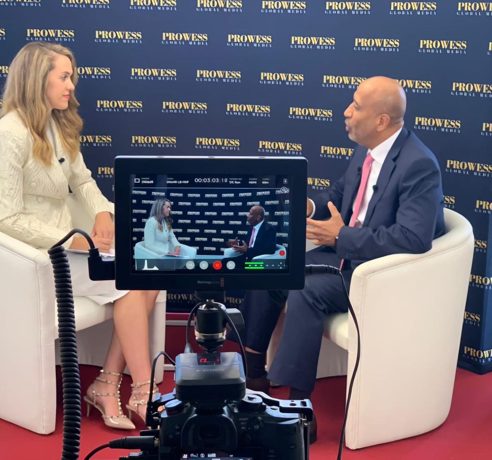 A televised interview at a summit