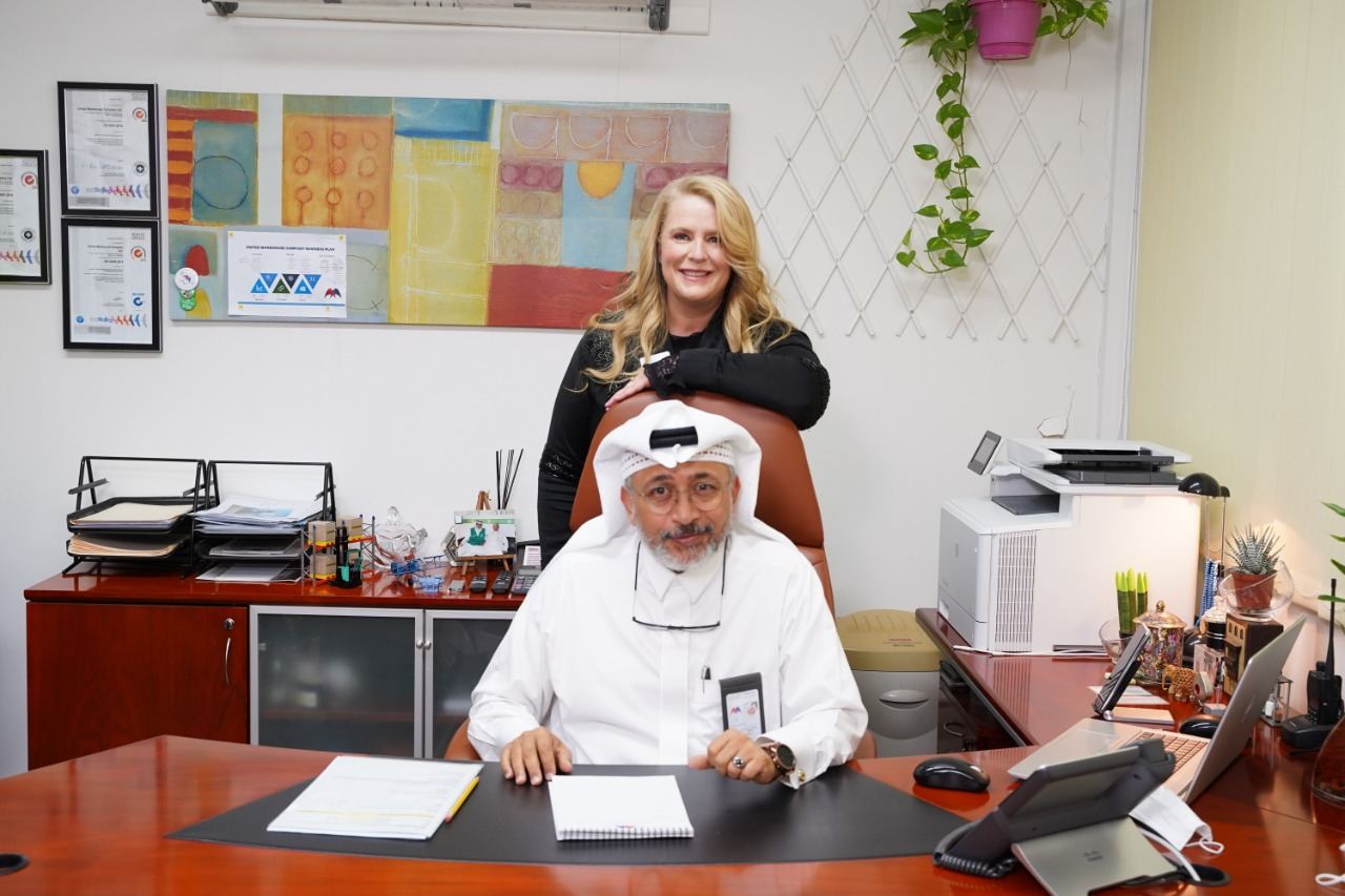A Guild member with a host at his office