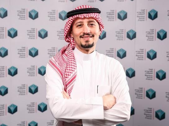 A gentleman in traditional Gulf dress at a forum