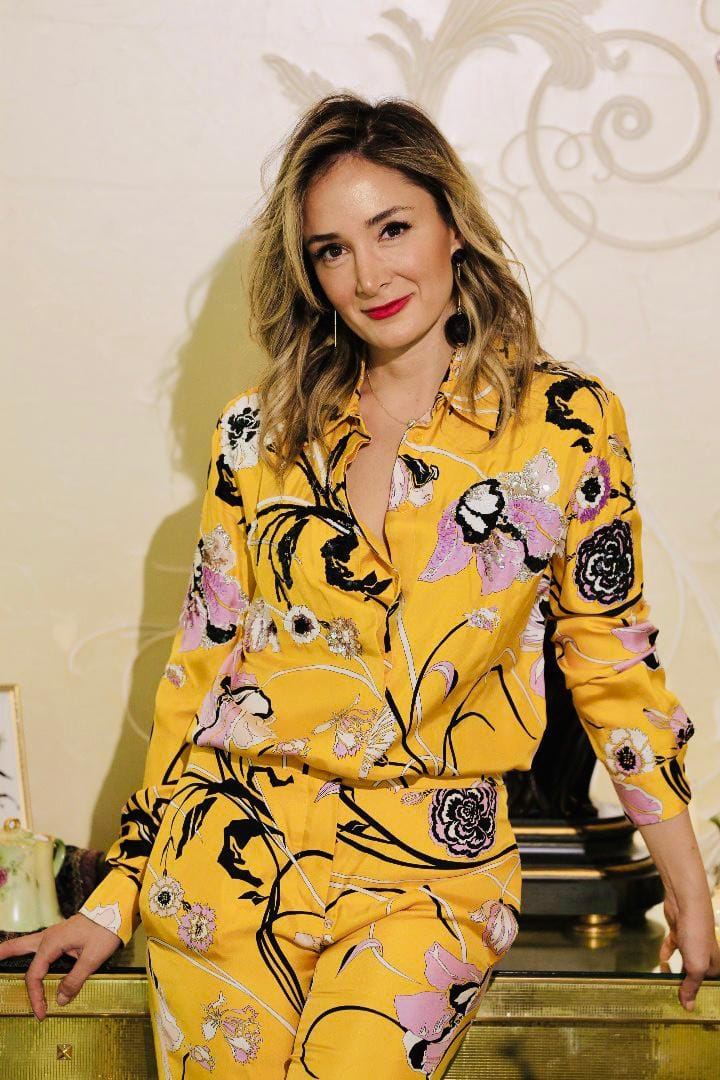 A guest in a floral outfit
