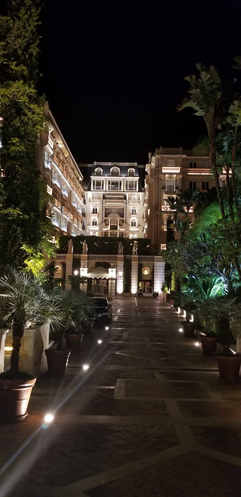 A grand hotel entrance at night