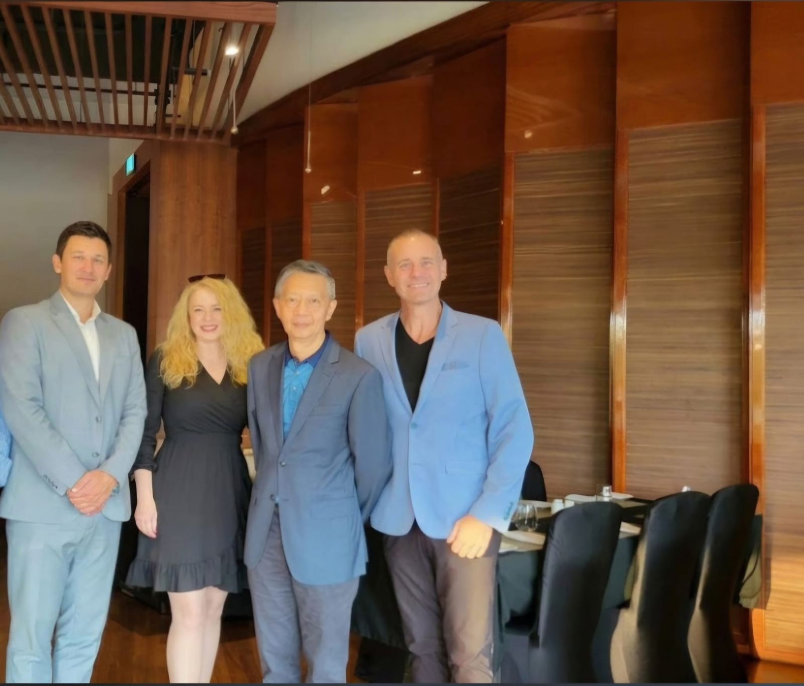 A group photo in a private dining room
